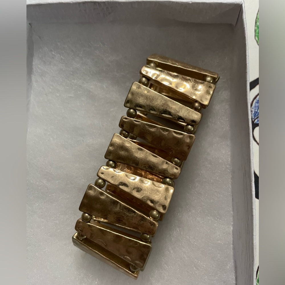 Gold colored stretch modern bracelet